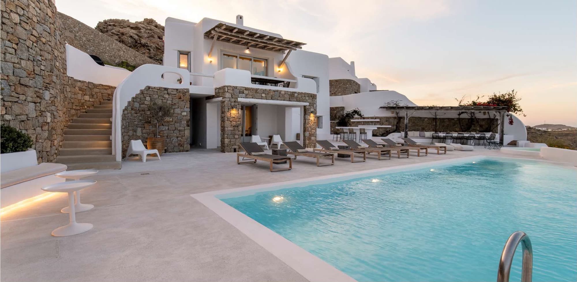 A villa terrace at dusk, the kind of room a pop-up salon takes over